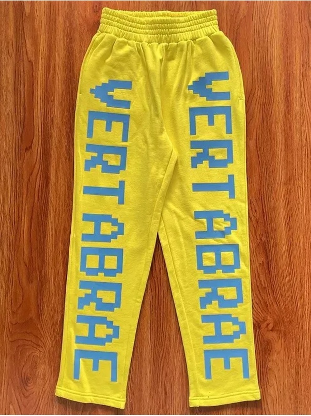 Popular Yellow Sweatpants with Blue Vertical Text